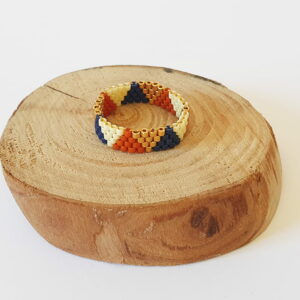 anillo terracota/azul marino//dorado con diseño triangular