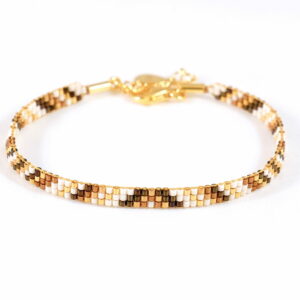 Pulsera de tres filas bronce/oro con diseño de triángulo y diagonales