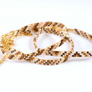 Pulsera de tres filas bronce/oro con diseño de franjas